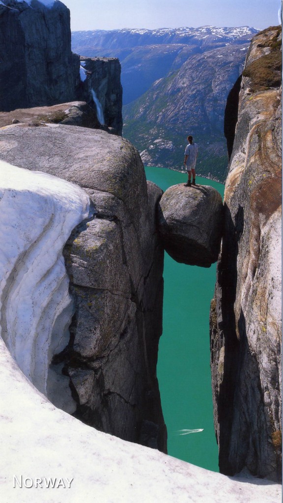 Kjeragbolten Kjerag Mountain Norway 576x1024 Spectacular Places You Should Visit in Your Life