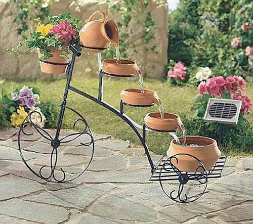 antique bycycle waterfall fountain garden decorations1 With These Decorations Make Your Garden Look More Interesting