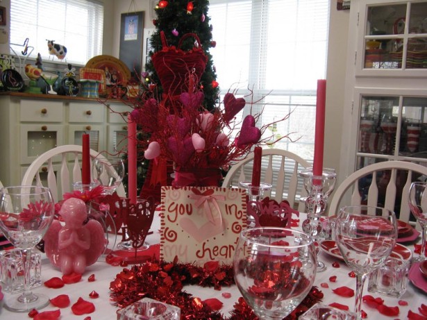 Love Arrangements Centerpiece Ideas with Nice Small Cupid Ornament and Red Garland for Valentines Day Table Decoration Ideas 615x461 15 Romantic Valentines Day Table Decorations