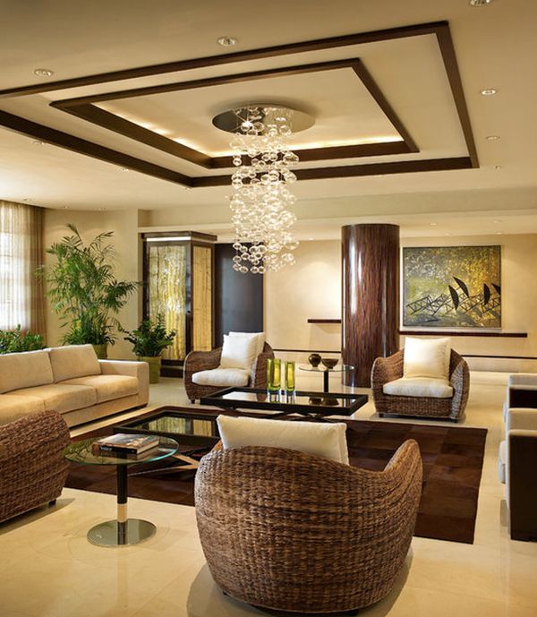 Warm living room with intricate ceiling design and gentle tones 16 Impressive Living Room Ceiling Designs You Need To See