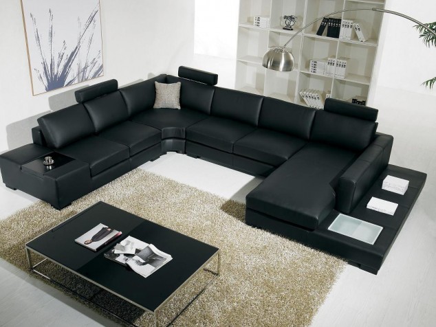 16 Leather Sofas for Modern Living Room Design cream shag hand tufted rug in modern living room sets and black u shaped leather sofa also chrome high arch floor lamp 634x476 16 Leather Sofas for Modern Living Room Design