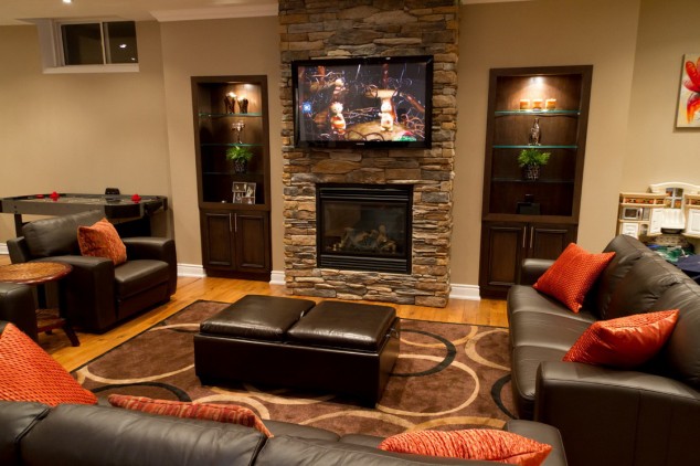 homey modern living room with brown leather couches featuring brick clad fireplace and tv over mantel 634x422 16 Leather Sofas for Modern Living Room Design