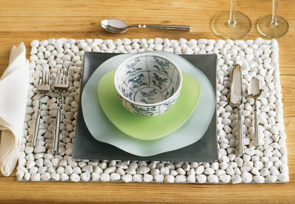 unique river stone placemats1 20 Creative Ideas Adding River Rocks For A Beautifully Decorated Home