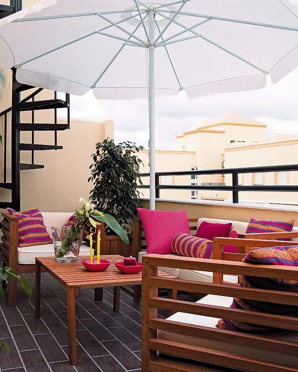 stylish balcony design with wooden patio furniture in pink 20 Small Cute Balcony Designs You Will Adore