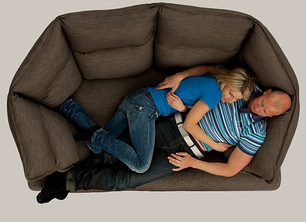 20 Nap Worthy Chairs for Your Utmost Relaxation model hugging grey envelope1 20 Nap Worthy Chairs for Your Utmost Relaxation