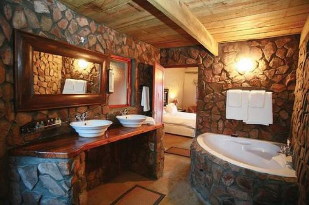16 Extraordinary Rustic Bathroom Design Ideas rustic bathroom ideas with stone wall decorations ideas 55863abc74af5 634x422 16 Extraordinary Rustic Bathroom Design Ideas
