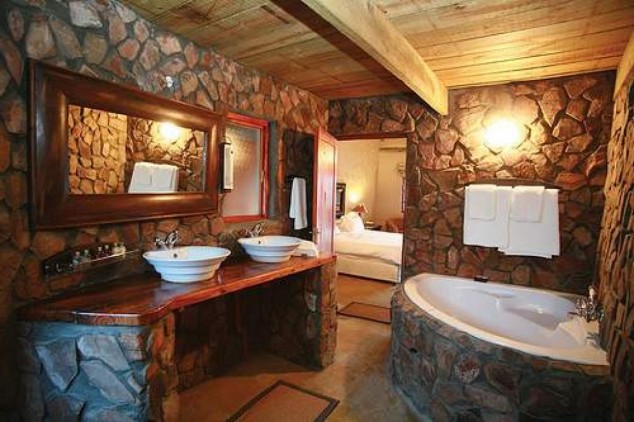 rustic bathroom ideas with stone wall decorations ideas 55863abc74af5 634x422 16 Extraordinary Rustic Bathroom Design Ideas