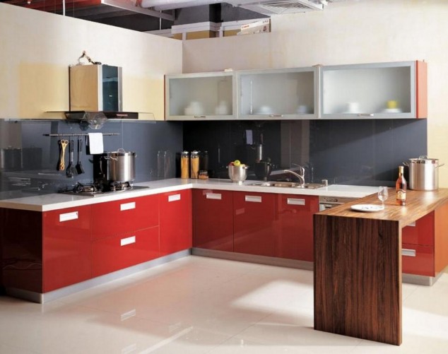 wooden breakfast bar in modern kitchen feat red base cabinets plus mirrored backsplash with wall mounted hood 1024x809 634x501 15 Stylish Modern Kitchen Designs That Will Fascinate You