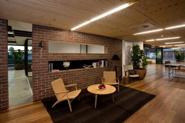 captivating lounge room design ideas in neutral color scheme overlooking with red brick wall partition on black area flooring base and oak arm chairs 915x610 634x423 15 Fascinating Accent Brick Walls In The Interior Design That Will Elevate Your Creativity