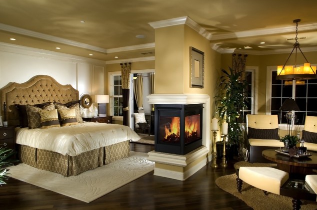 15 Ultra Modern Two Sided Fireplaces That Make A Real Wow Addition In Your Home contemporary brown bed with tufted headboard plus luxury master bedroom two sided fireplace1 634x421 15 Ultra Modern Two Sided Fireplaces That Make A Real Wow Addition In Your Home