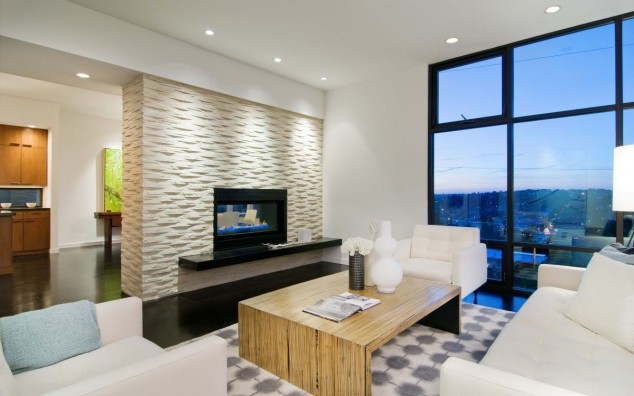 white interior theme feat modern fireplace mantel 634x396 14 Examples Of Sensational Stone And Tile Accent Walls In The Living Room