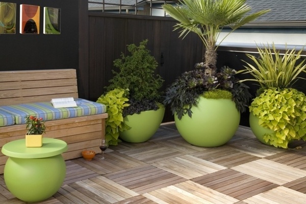 15 Chic And Interesting Ideas For Your Balcony Floor Planters ideas wooden floor green flower pots attractive balcony 15 Chic And Interesting Ideas For Your Balcony Floor