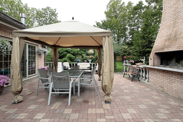 brick patio cabana outdoor fireplace 634x423 13 Ideas How To Make An Inviting Patio Design Using Bricks