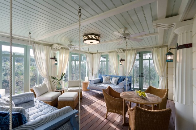 15 Relaxing Hanging Beds For Absolute Enjoyment hanging swing bed and wicker chairs with cushions also hanging curtains for enclosed front porch ideas plus drum chandelier with ceiling fans1 634x422 15 Relaxing Hanging Beds For Absolute Enjoyment