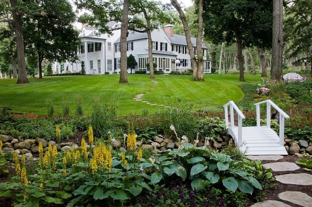 21 Brilliant Wooden Garden Bridges That Could Fill The Garden With Beauty And Charm small stream ideas and private garden design and white garden bridge and plenty greenery ideas and lush green lawn and furniture seating bench and chair 634x420 21 Brilliant Wooden Garden Bridges That Could Fill The Garden With Beauty And Charm
