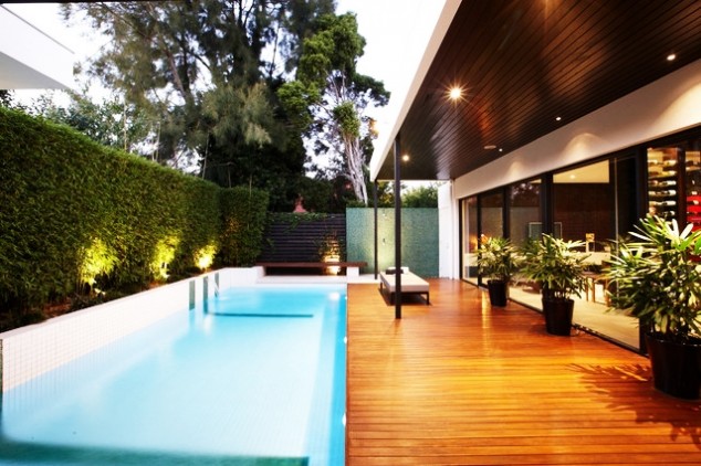 Awesome Swimming Pools Melbourne with Shiny Outdoor Lights Precious Green Wall and Ornamental Plants Cushy Padded Bench 634x422 16 Relaxing Backyard Swimming Pool Designs