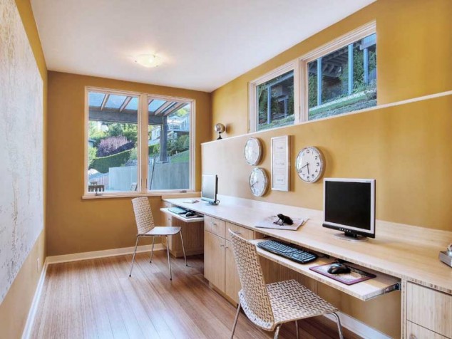 an inspiring long wooden two person desk home office completed with two unique computer chairs also some wall mounted clocks 634x476 15 Home Office Ideas To Get Inspiration From