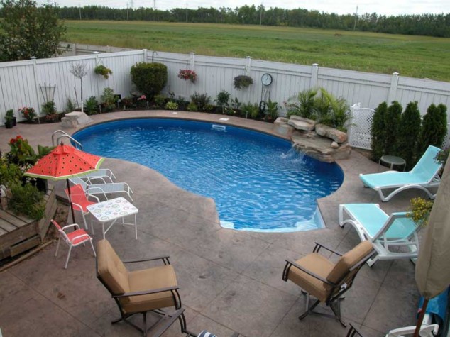 10+ Ideas For Wonderful Mini Swimming Pools In Your Back Yard contemporary swimming pool designs for small yard with stone fountain ideas small pools for small yards 634x475 10+ Ideas For Wonderful Mini Swimming Pools In Your Back Yard