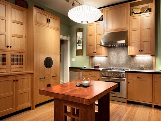 13 Glamorous Asian Kitchen Designs For Better Home japanese kitchen with bamboo flooring and wooden cabinets and island with stove and hood 634x476 13 Glamorous Asian Kitchen Designs For Better Home