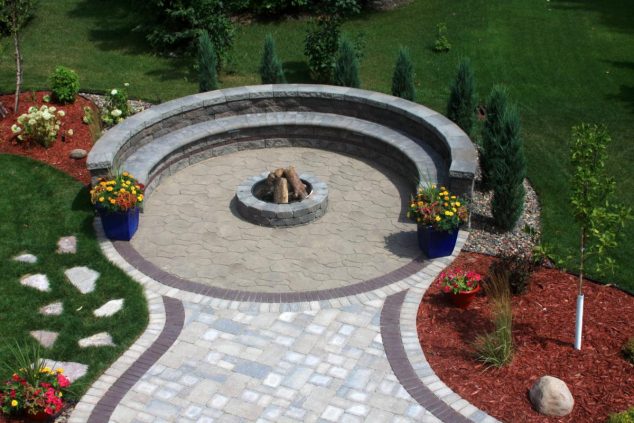 13 Circle Patio Ideas That Are Attractive For Your Eyes modern round flagstone circle patio with grey floor tile can add the modern touch inside patio design ideas with red yard arround can add the beauty inside 634x423 13 Circle Patio Ideas That Are Attractive For Your Eyes