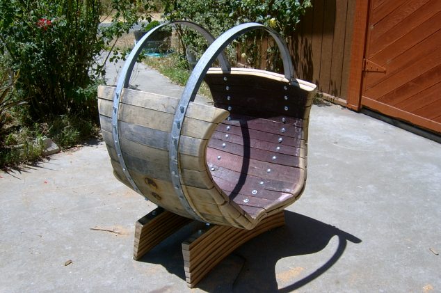 new log holder and Gina Bench 002 634x421 14 DIY Fascinating Ideas How To Reuse Old Wine Barrels
