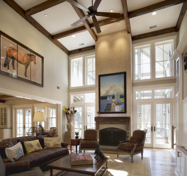 13 High Ceiling Living Room That Will Make The Room Bigger awesome high ceiling living room with brown wooden beam fan white scheme single sofa square table carpet laminated floor cabinet desk lamp glass window japanese ceiling beams 634x597 13 High Ceiling Living Room That Will Make The Room Bigger