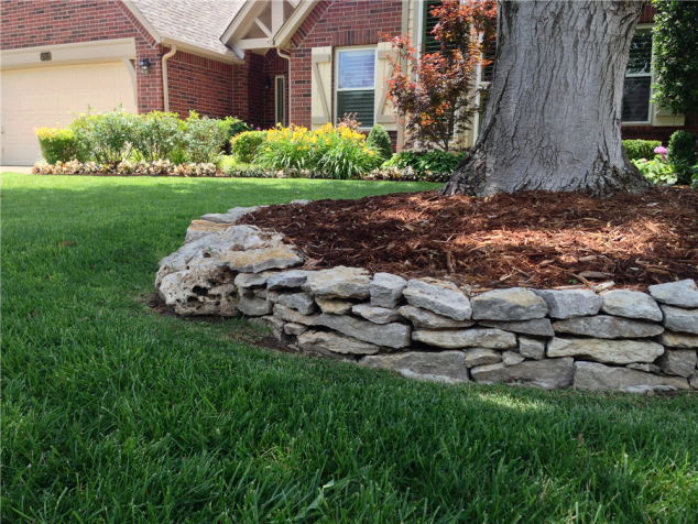 tulsa landscape dry stacked plate limestone wall edging 634x476 12 Attractive Garden Edging Ideas With River Stones That Provide Inspiration