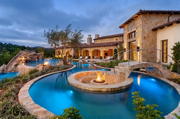 16 Garden And Backyard Swimming Pool Stepping Ideas that You Dream For Fire pit at the heart of the pool with sunken seating around it and a beautiful bridge leading the way 634x418 16 Garden And Backyard Swimming Pool Stepping Ideas that You Dream For