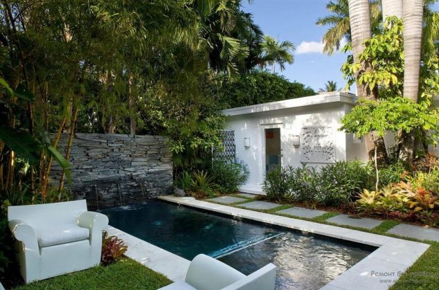 16 Garden And Backyard Swimming Pool Stepping Ideas that You Dream For an awesome swimming pool with deep blue water and stunning stone wall fountain also concrete stepping stone sunken in grassy field plus white armchairs 634x419 16 Garden And Backyard Swimming Pool Stepping Ideas that You Dream For