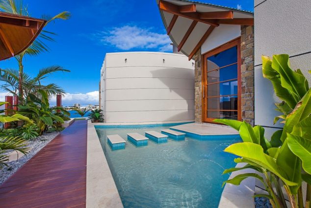 16 Garden And Backyard Swimming Pool Stepping Ideas that You Dream For concrete stepping stones Entry Tropical with blue mosaic tile pool 634x423 16 Garden And Backyard Swimming Pool Stepping Ideas that You Dream For