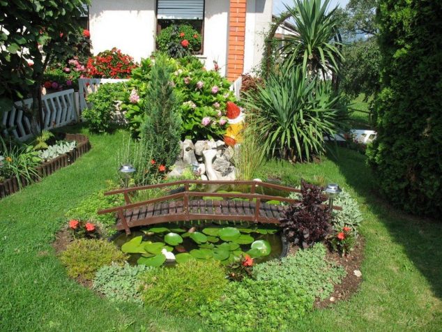 15 Inspirative Garden Pond With Bridge That You Would Like To See garden and patio small backyard garden house design with green grass and small pinds with wooden bridge surrounded by various plants ideas backyard plants backyard plants backyard pond 634x476 15 Inspirative Garden Pond With Bridge That You Would Like To See