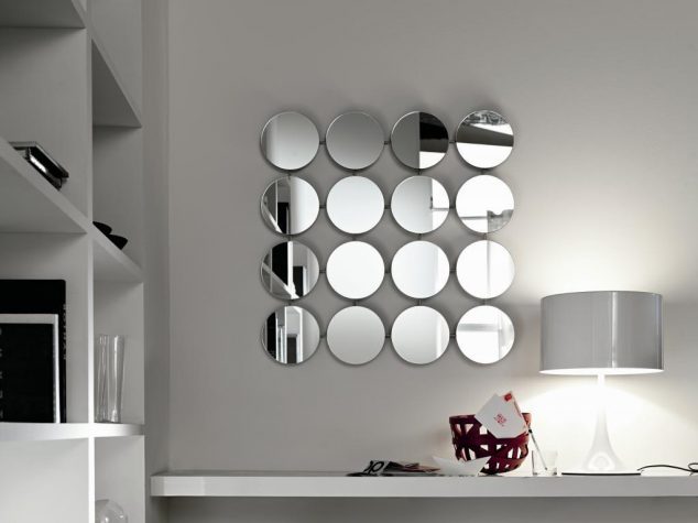 15 Wall Decoration That Tells a Lot About The House Modern room interior design with unique many round mirror on the wall above table gray lamp desk the top and wooden furniture shelves in the near 634x475 15 Wall Decoration That Tells a Lot About The House