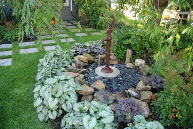 Water Fountains for Gardens With Stone Decorative Gravel 634x425 15 Standout Fountain Design for Garden Art That Will Catch Your Eye