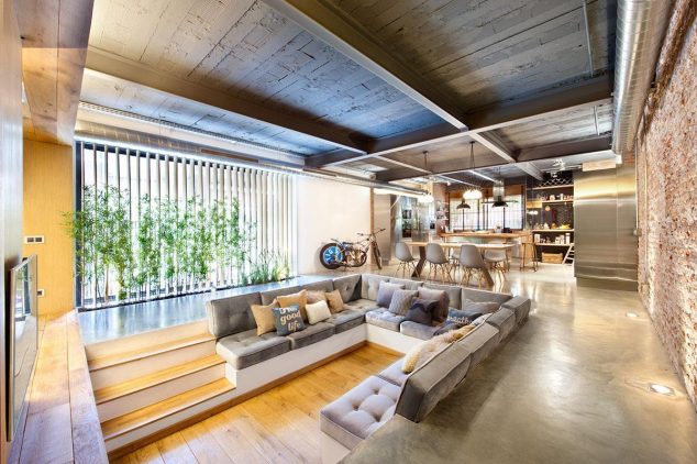 15 Smart Ways How To Decorate Your Home With Built Ins To Save Space an interesting lower stage wooden living room with simple velvet grey built in sofa and brown and grey cushions 634x422 15 Smart Ways How To Decorate Your Home With Built Ins To Save Space