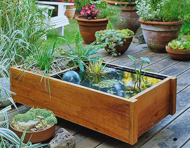 creative water gardens 634x493 15 Standout Fountain Design for Garden Art That Will Catch Your Eye