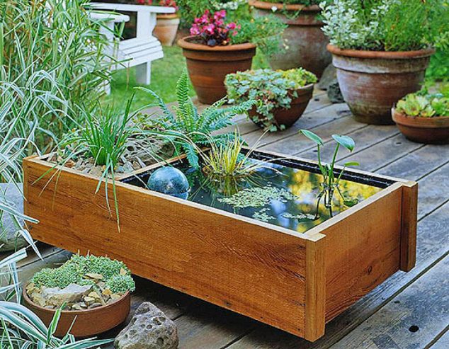 15 Standout Fountain Design for Garden Art That Will Catch Your Eye creative water gardens 634x493 15 Standout Fountain Design for Garden Art That Will Catch Your Eye