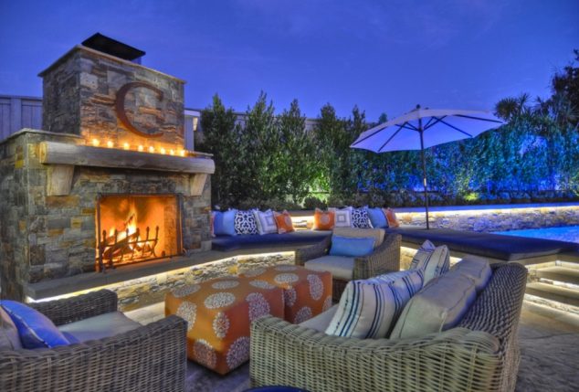 incredible blue lighting with classic luxurious garden design with wall living plants and massive stony firepit with stylish wickery furnitures and cool white floor lighting with fancy pool 634x429 10+ Urban DIY Backyard and Patio Lighting Ideas