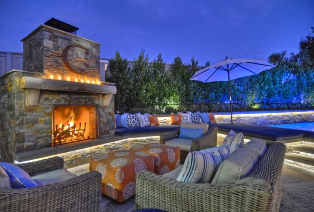 10+ Urban DIY Backyard and Patio Lighting Ideas incredible blue lighting with classic luxurious garden design with wall living plants and massive stony firepit with stylish wickery furnitures and cool white floor lighting with fancy pool 634x429 10+ Urban DIY Backyard and Patio Lighting Ideas