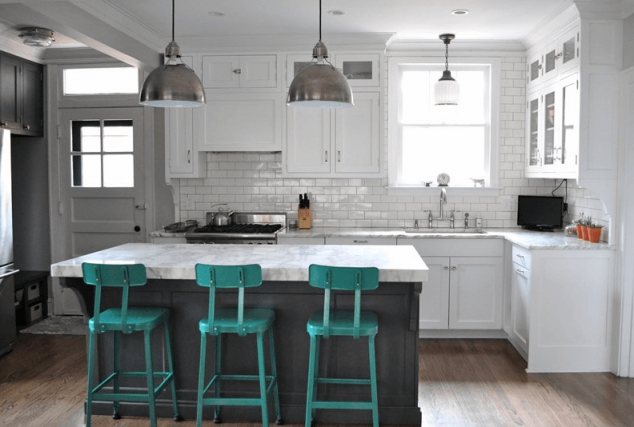 17 Kitchen Islands With Seating Options That are Must Have For This Year stone island with blue chairs2 634x427 17 Kitchen Islands With Seating Options That are Must Have For This Year