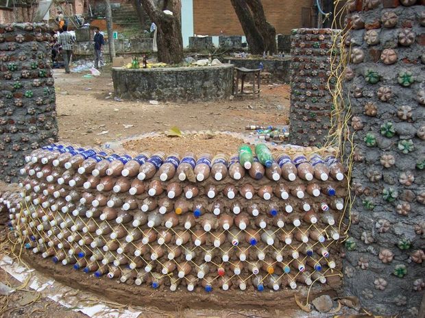 FX8CEH4FTNHELKX.MEDIUM How to Build a House by Using Plastic Bottles