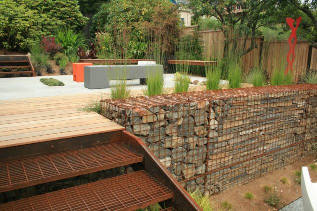 16 Magnetic Garden Design That Will Attract Your Attention glass rocks for landscaping Deck Industrial with contemporary deck Gabion Wall 634x423 16 Magnetic Garden Design That Will Attract Your Attention
