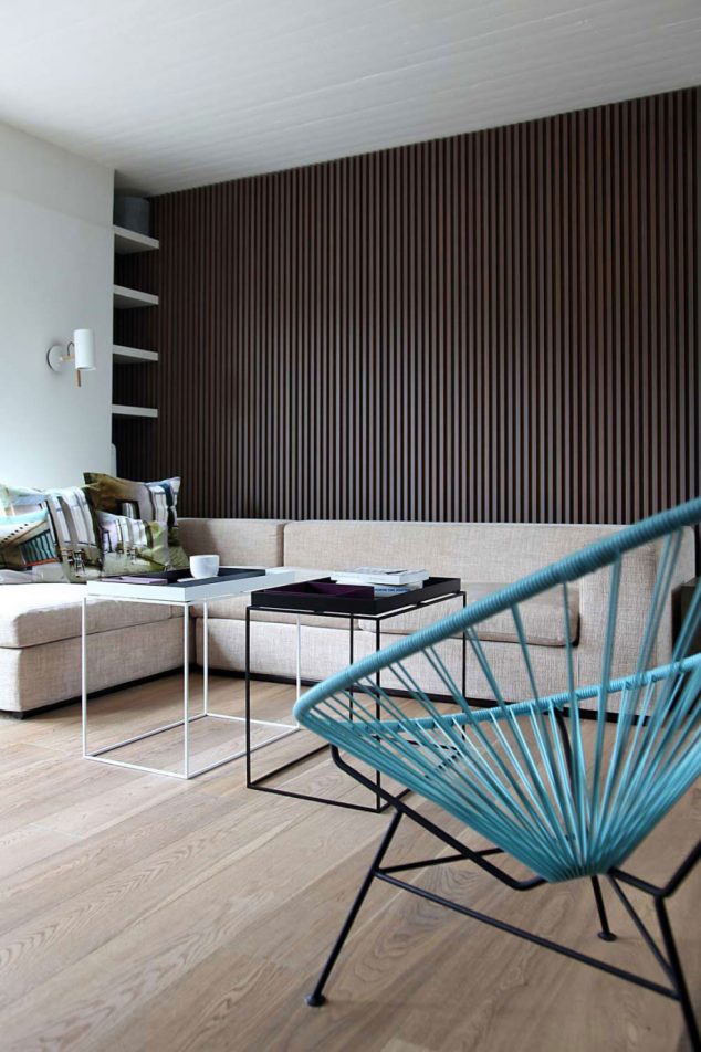 15 Vivid Ways to Decor the Interior Walls With Wooden Art Design mesmerizing unique blue chair with black and white table and creamy sofa view feats parquet varnised wall astounding engineered solid wooden floor design clean interior 915x1374 634x952 15 Vivid Ways to Decor the Interior Walls With Wooden Art Design
