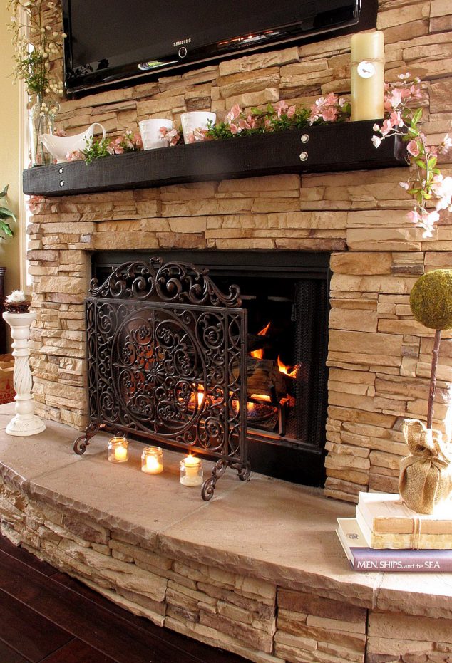Traditional light beige stacked stone fireplace design with candles and tiny flowers decorated special design for outdoor and indoor fireplace designs 634x931 12 Stacked Stone Walls That Will Add Charm In Your Home