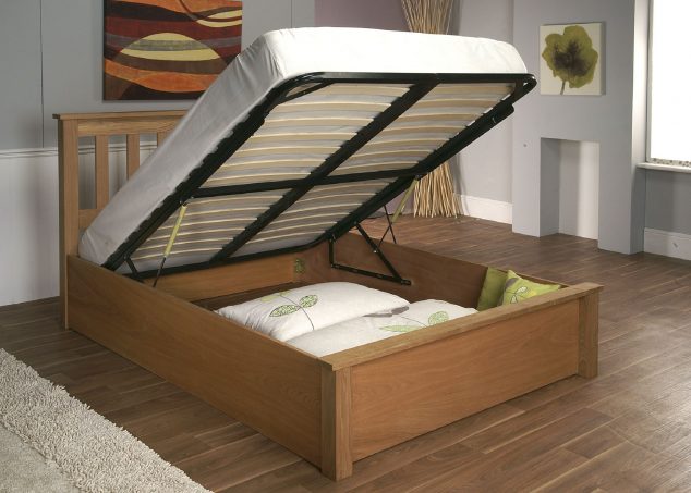 15 Desperately Needed Multi functional Bed With Storage For Your Bedroom brown lacquer oak wood bed frame with large storage underneath placed on hickory hardwood floor 634x453 15 Desperately Needed Multi functional Bed With Storage For Your Bedroom