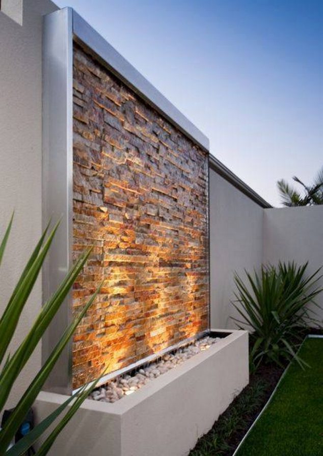 garden lighting idea 634x896 12 Stacked Stone Walls That Will Add Charm In Your Home