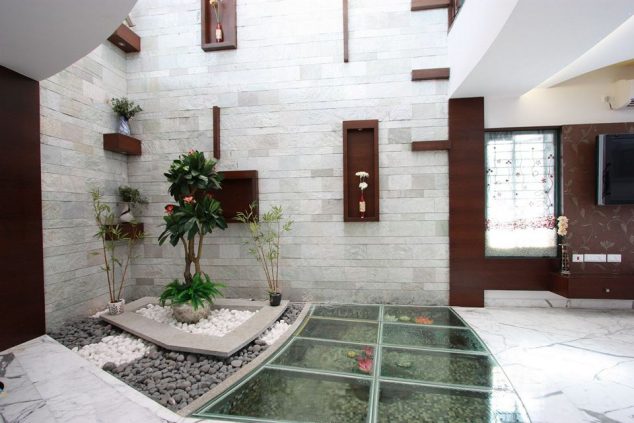 DIY Exciting Project For Adding Glass Flooring With Pebble in Your Perfect Home 9 thopputhurai curved house fish pond 634x423 DIY Exciting Project For Adding Glass Flooring With Pebble in Your Perfect Home