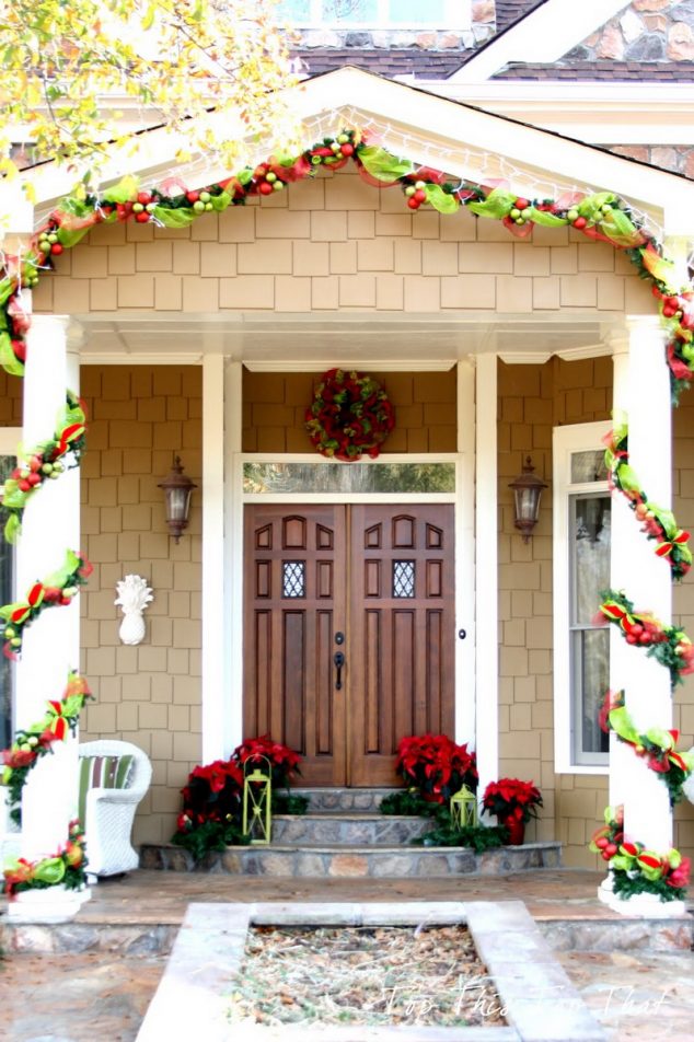 15 Sensational Christmas Front Door Decor With Lovely Red Poinsettias decorating ideas marvellous front porch christmas decorating design ideas with solid wood double front door along with cream brick exterior wall and christmas 634x952 15 Sensational Christmas Front Door Decor With Lovely Red Poinsettias