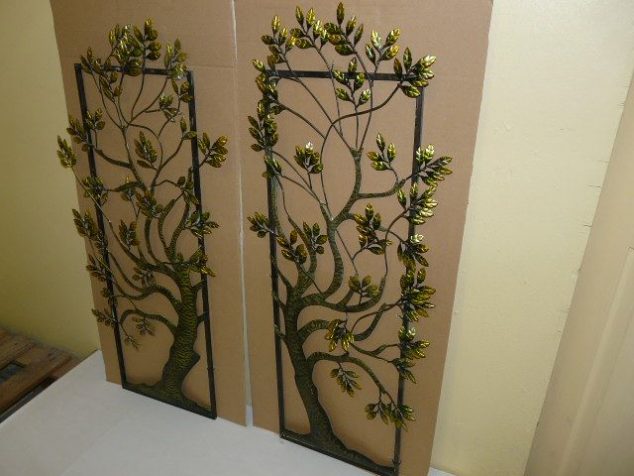 marvelous ideas metal wall art outdoor rectangular shape tree root branches leaves brown green 634x476 15 Timeless Metal Wall Art For a Breathtaking First Impression