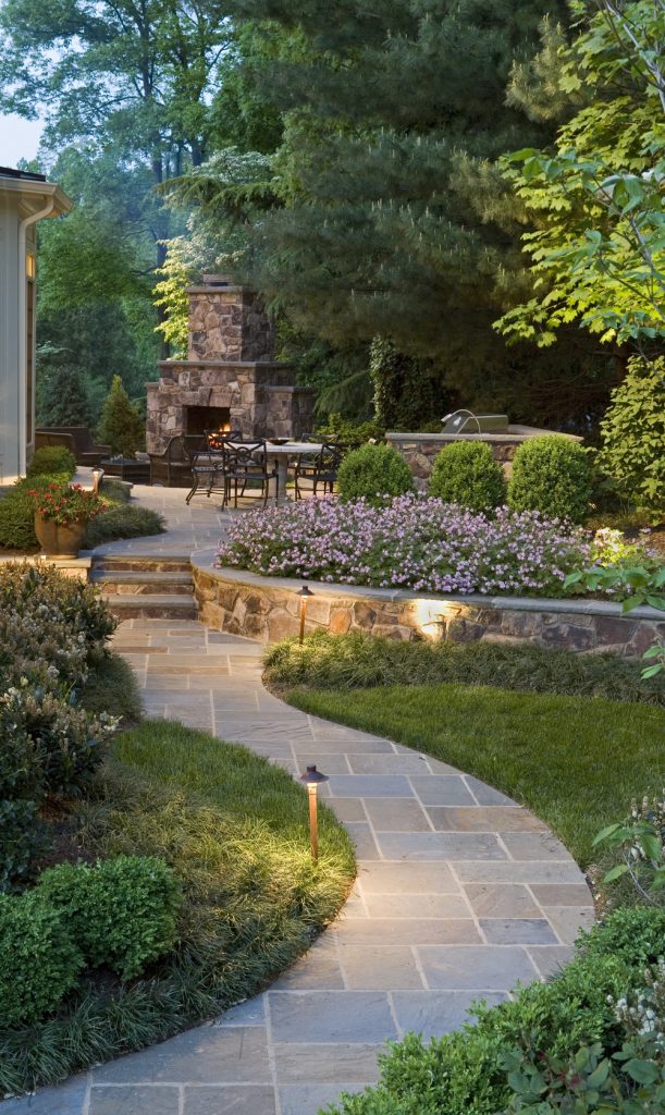 15 Amazing Garden Walkways That Will Charm You 22 backyard landscaping fireplace patio homebnc 611x1024 15 Amazing Garden Walkways That Will Charm You