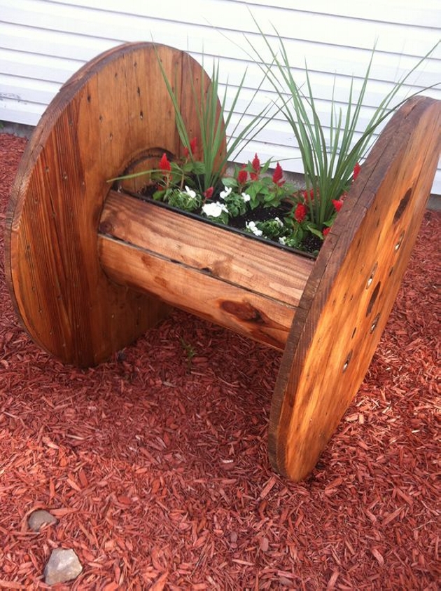 15 Wonderful Garden Design to Delight You large wood cable spool turned planter original source unknown 15 Wonderful Garden Design to Delight You